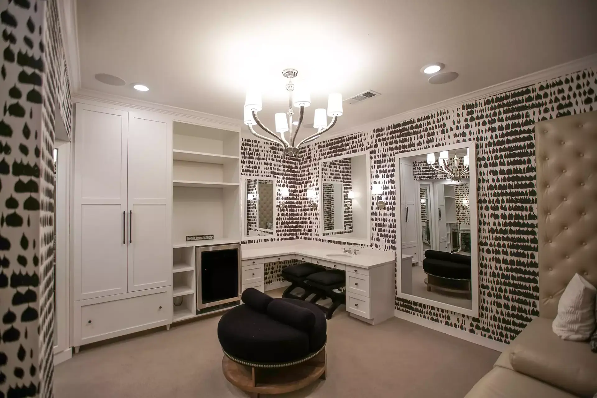 large student apartment closet with L shaped vanity and plush seating